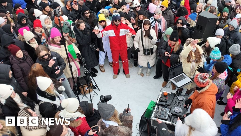 Frozen river hosts dance party in Kyiv